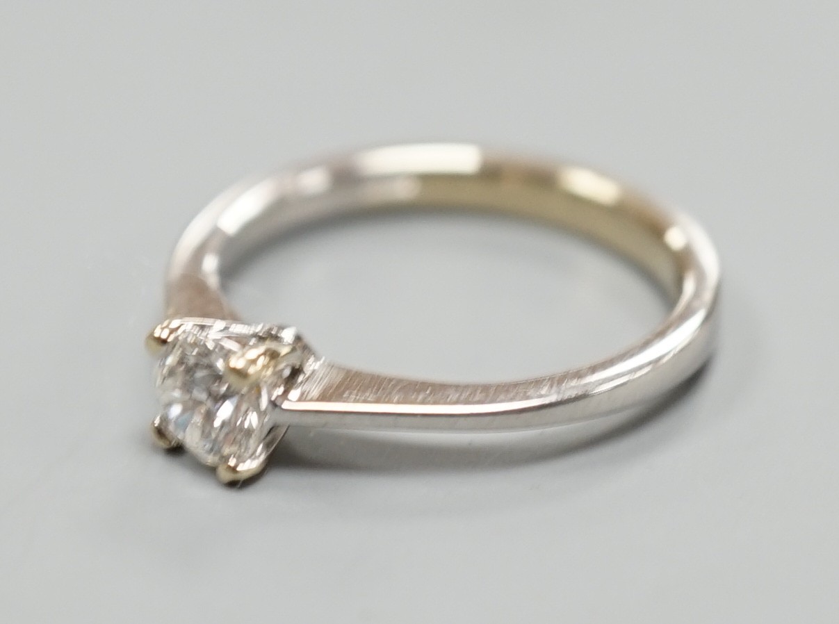 A modern Italian 750 white metal and solitaire diamond ring, size L/M, gross weight 2.8 grams.